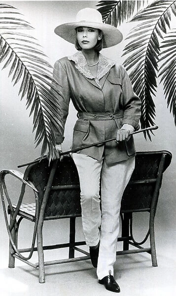 Fashion 1980s Model wearing a cotton blouse with white linen jodhpurs