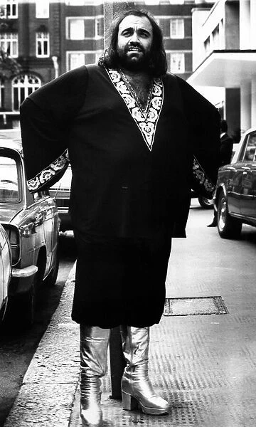 Greek singer Demis Roussos wearing platform boots and a Kaftan 2 October 1976