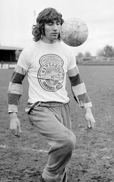 Hayes striker Robin Friday wearing a Newcastle Brown Ale t-shirt during a training sesion