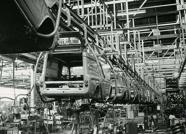 Hillman Imp cars and vans on production line hanging from cradles at Rootes car factory