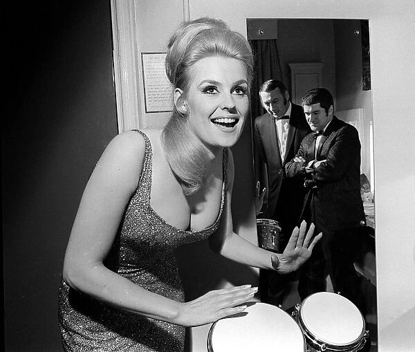 Lesley Langley April 1967 former Miss World on the bongo watched by her new partners jazz