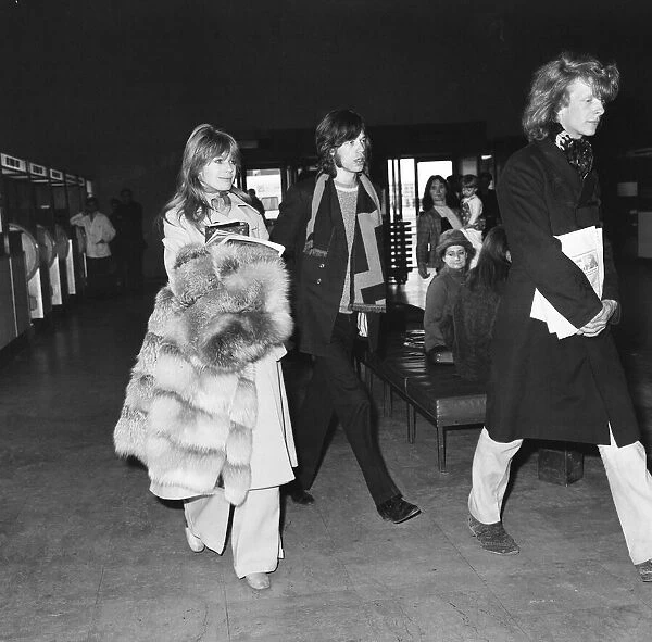 Mick Jagger and Marianne Faithful seen here at London Airport leaving for Dublin