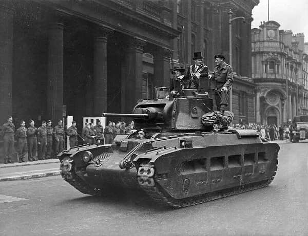 Norman Tiptaft Lord Mayor of Birmingham rides a Matilda tank at the head of a parade