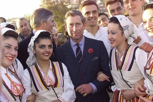 Prince Charles the Prince of Wales is pictured as he meets dancing girls in Ohrid in