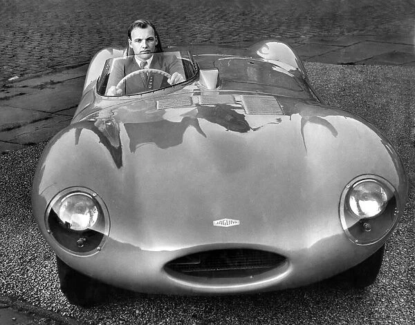 Racing driver Brian Naylor seen here behind the wheel of a D-type Jaguar