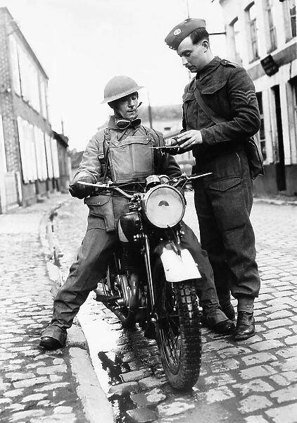 WW2 A dispatch rider from the Hampshire Regiment receives a message from headquarters