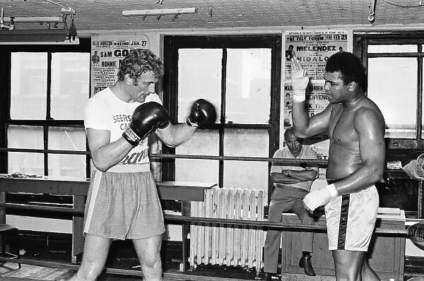 A young Joe Bugner (left) going through his paces with former World Heavyweight Champ