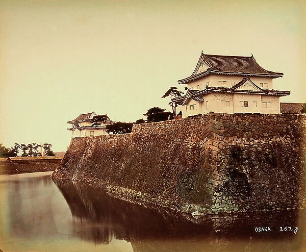 A bastion of the fort of Osaka, Japan, surrounded by a moat full of water