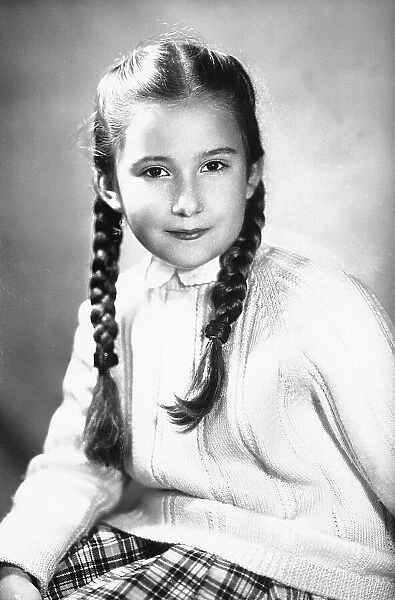 Portrait of a girl with pigtails
