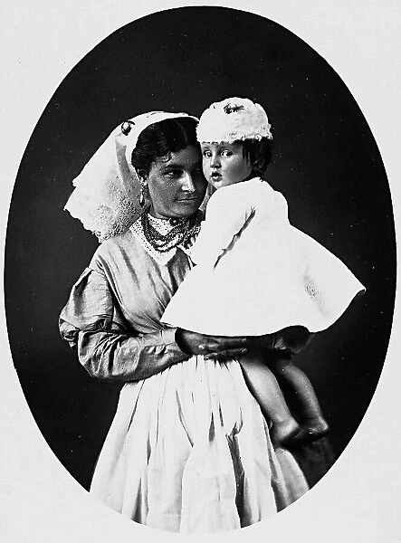 Portrait of a mother with her child in her arms