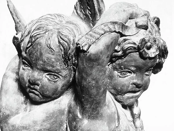 Two putti, left detail of the Annunciation, high relief by Donatello, in the Basilica of Santa Croce, Florence, Tuscany
