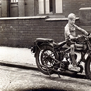 Boy on a 1923 / 4 Triumph motorcycle