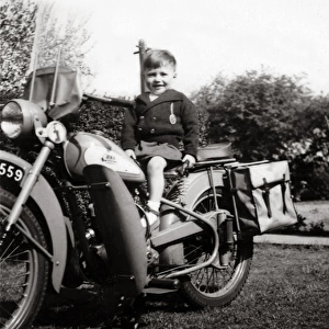 Boy on a 1951 / 2 BSA Bantam motorcycle