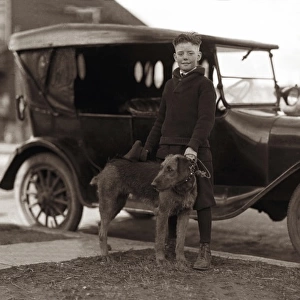 A boy, his dog and a car