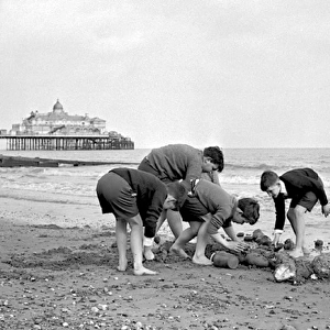 Boys building a sandcastle, Eastbourne, Sussex