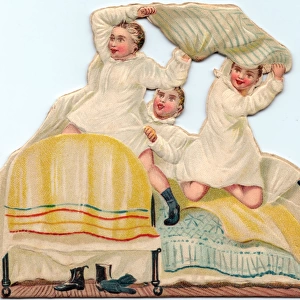 Three boys pillow fighting on a cutout greetings card