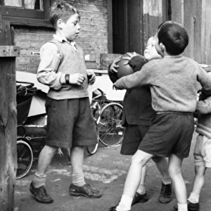 Boys playing football in a street, Balham, SW London