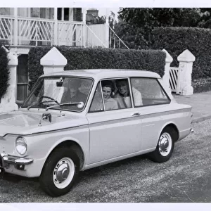 A family out for a drive in their new Hillman Imp