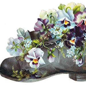 Flowers in an old boot on a greetings card