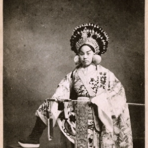 Japan - Kabuki actress with large headdress and sword
