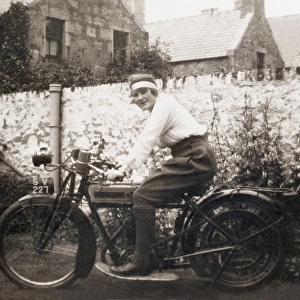 Lady sitting on 1918 Triumph motorcycle