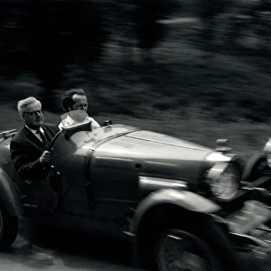 Two men in a Bugatti sports car