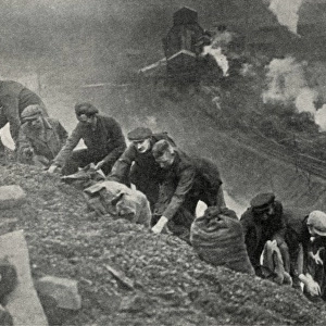 Men searching for coal on slag heap
