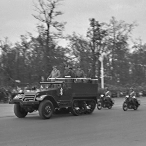 Military parade with jeeps and motorbikes