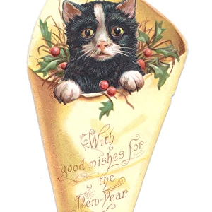 New Year card in the shape of a kitten in wrapping paper