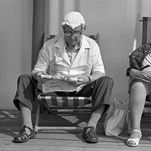 Old couple in deck chairs, Great Yarmouth, England