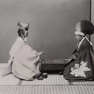 Shinto priests (actors) playing board game Go Japan