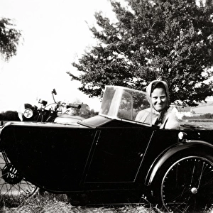 Woman in sidecar of 1938 BSA motorcycle