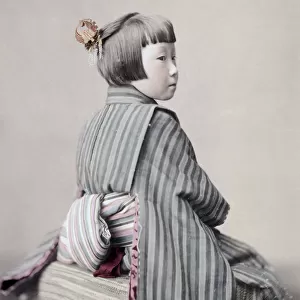 Young girl in Kimino showing her obi sash, Japan, c, 1890