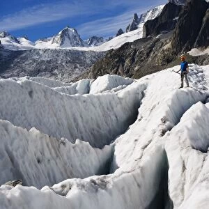 Aclimber in a crevasse field on Mer de Glace glacier, Mont Blanc range