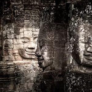 Ancient faces carved in stone at Bayon temple, Angkor Wat, UNESCO World Heritage Site, Cambodia, Indochina, Southeast Asia, Asia
