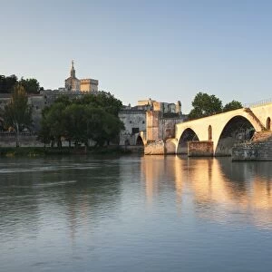 Bridge St. Benezet over Rhone River with Notre Dame des Doms Cathedral and Papal Palace at sunrise