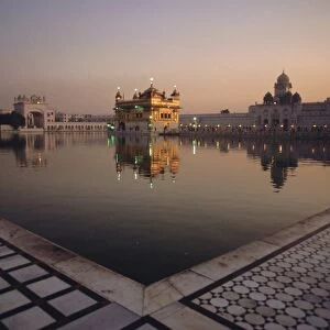 Dawn at the Golden Temple and cloisters and the Holy Pool of Nectar