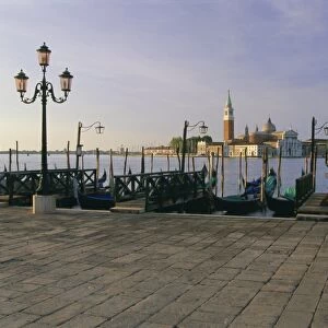 Gondolas moored with the island of San Giorgio Maggiore beyond