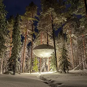 Illuminated UFO shaped room in the frozen forest covered with snow, winter view, Swedish Lapland, Harads, Sweden, Scandinavia, Scandinavia, Europe