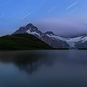 Star trail over Bachalpsee and the Bernese Oberland mountains, Grindelwald, Bern Canton, Switzerland, Europe