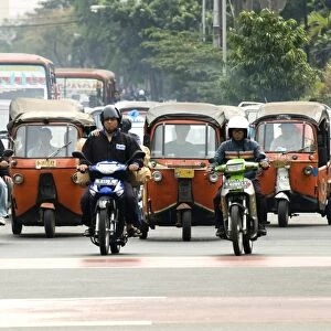 Traffic including tuk-tuk or bajaj, Jakarta, Java, Indonesia, Southeast Asia, Asia