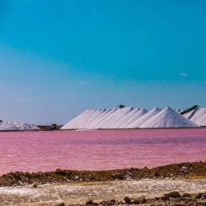 View of the pink colored ocean overlooking the Salt Pyramids of Bonaire from afar