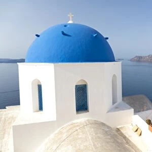 White church with blue dome overlooking the Caldera, Oia, Santorini, Cyclades, Greek Islands