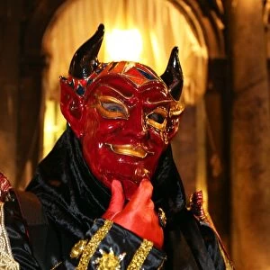 Person wearing a demon mask and costume at the Venice Carnival