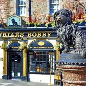Statue of the loyal Skye Terrier dog Greyfriars Bobby and pub of the same name in Edinburgh