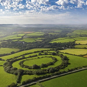 Aerial vista of Tregeare Rounds Iron Age Hillfort surrounded by Cornish countryside