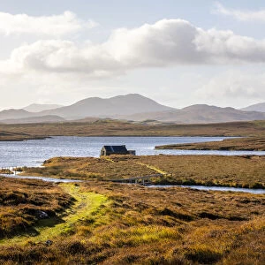 Bothy beside a loch and beautiful mountains beyond, Isle of Harris, Outer Hebrides