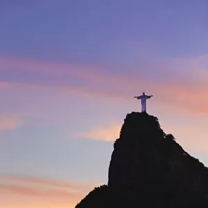 Christ the Redeemer statue (Cristo Redentor) at sunset, Corcovado, Rio de Janeiro, Brazil