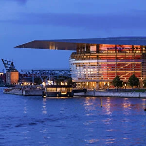 Copenhagen Opera House reflecting in the canal by night, Denmark
