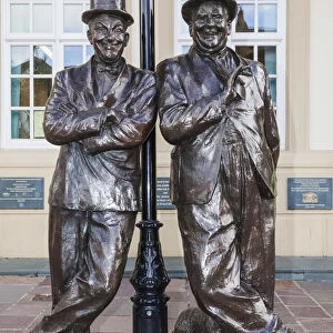 England, Cumbria, Lake District, Ulverston, Statue of Laurel and Hardy in front of